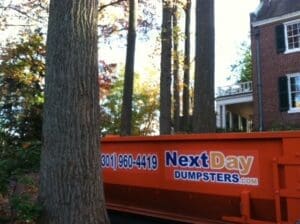 Next Day Dumpster dumpster in front of home