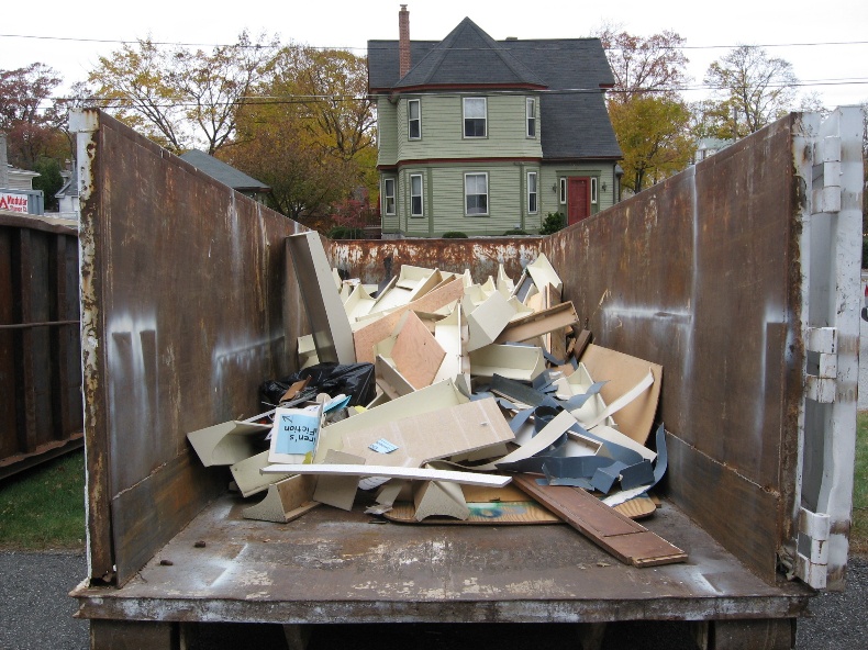 Dumpster with broken furniture