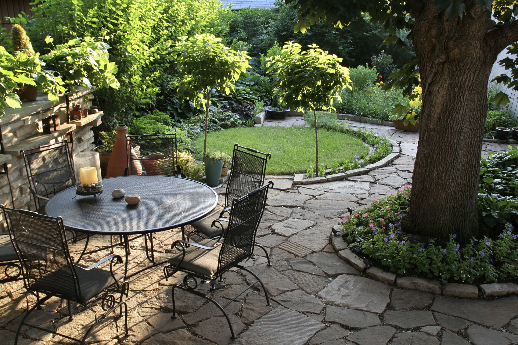 Backyard with seating area and paved pathways