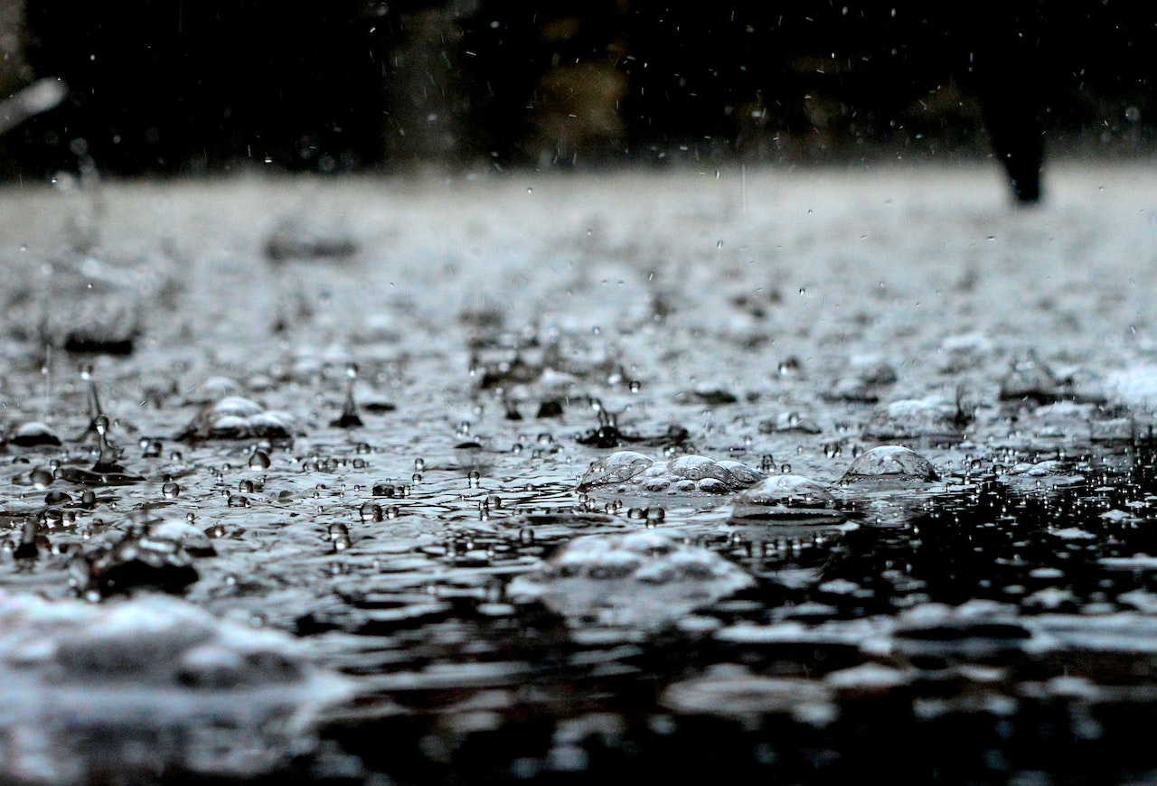 Closeup of water droplets on a black surface